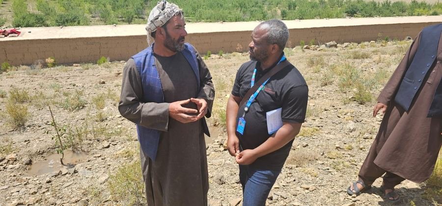 In conversation with a community elder, Afghanistan